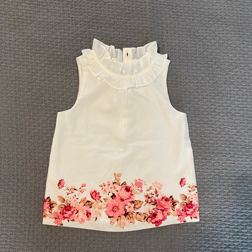 NWT! White sleeveless top with pink flower detail and high ruffle neck